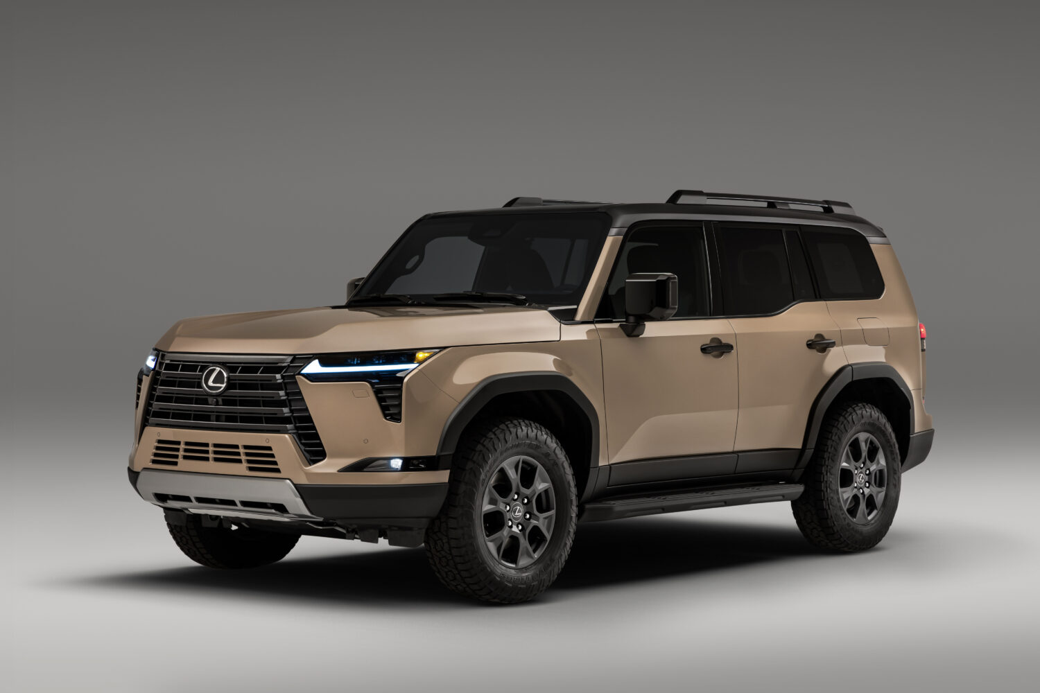 Lexus GX Overtrail in sand beige, front three-quarter studio view
