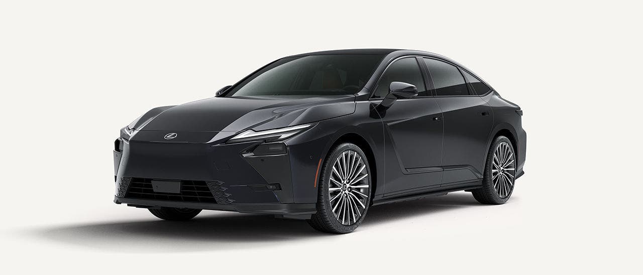 Lexus ES in black, side profile on a pale studio background