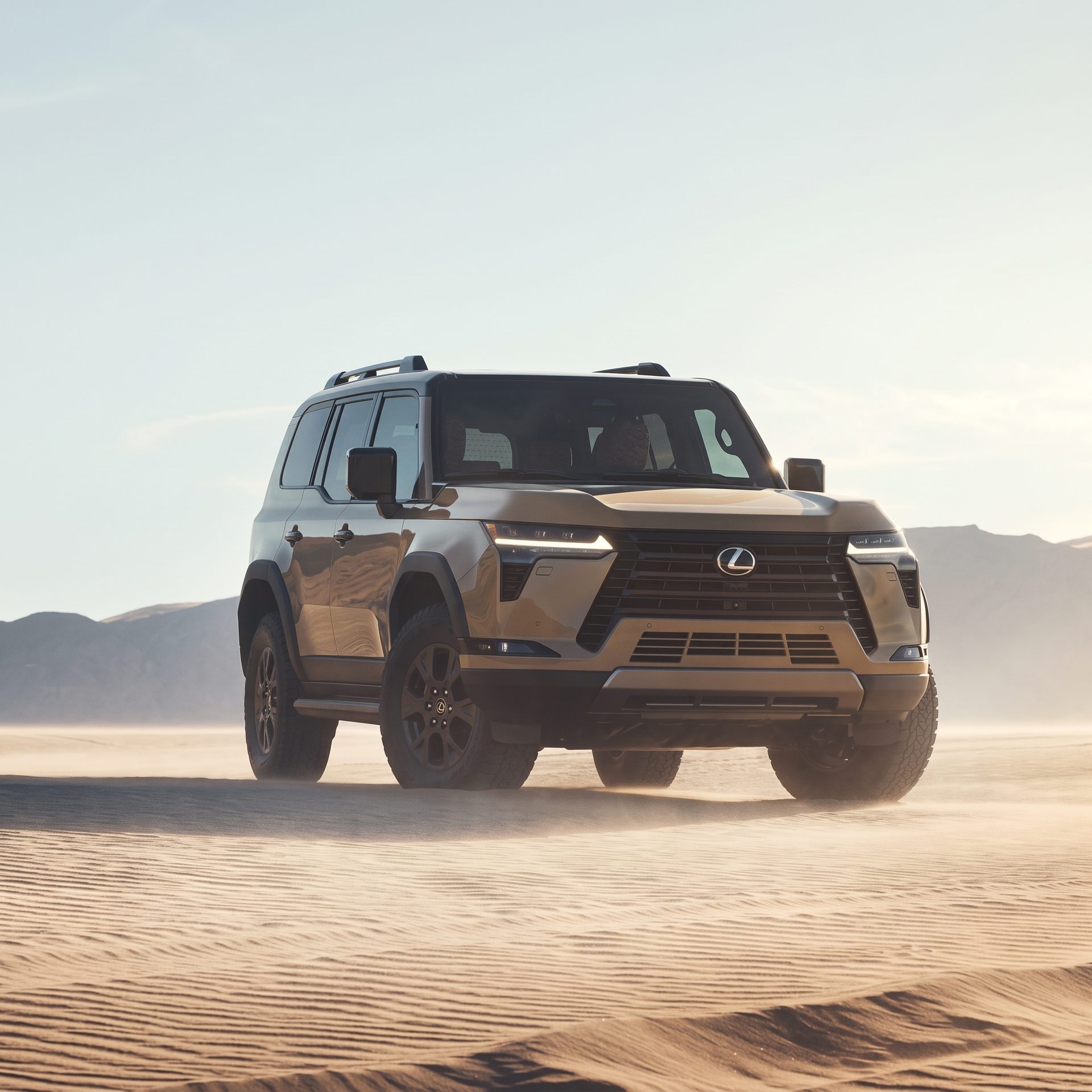 A Lexus GX driving across open sand, throwing up dust, with low hills behind
