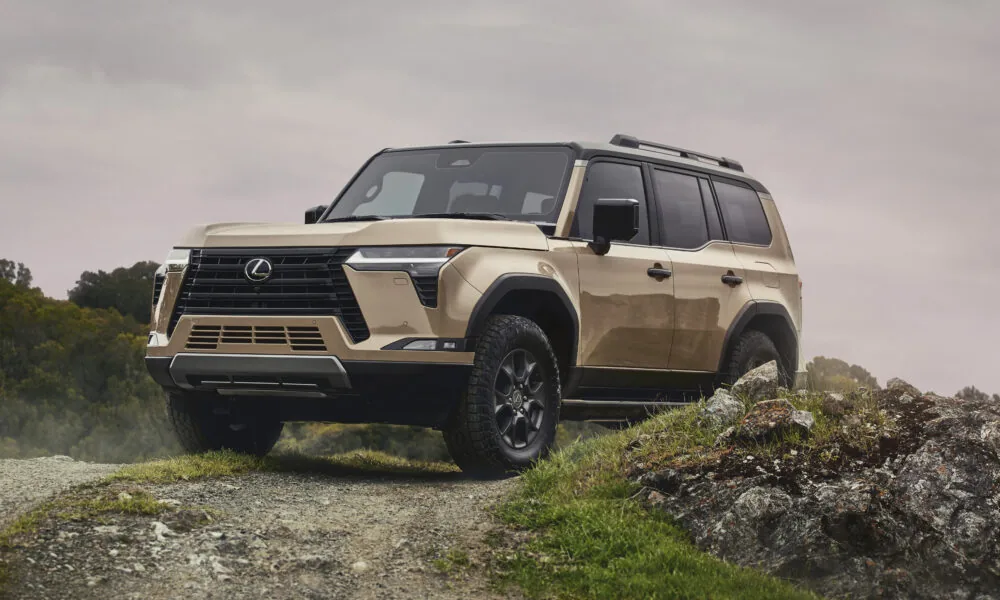 A sand-colored Lexus GX Overtrail on a rocky trail