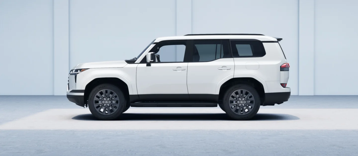 Lexus GX in white, full side profile showing its boxy roofline and roof rails