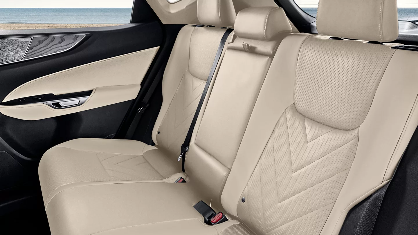 The rear seat of a Lexus NX in cream leather, seen from the side
